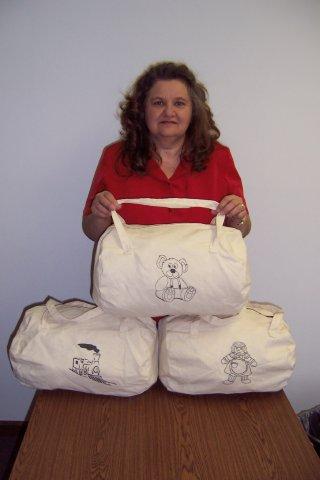 Charlotte Geppert with Duffle Bag Samples